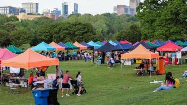 colorful tents outdoors with people walking around