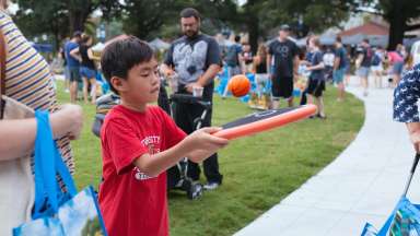 a kid playing a game in the park