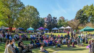 an event at the Fred Fletcher amphitheater with tents and a lot of people