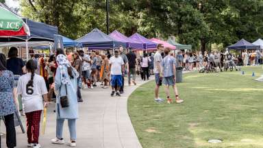 an event at Moore square with tents and lots of people