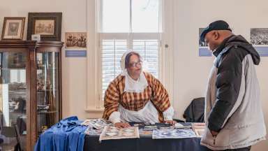 an event at the Pope house museum with a person dressed in historical clothing