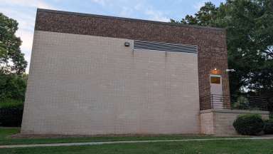 A blank wall on the side of a building
