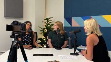 Shikha Gupta and Ellen Mathis sit in recording studio with Raleigh Magazine's Gina Stephens.