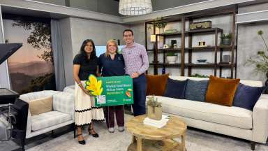 Solid Waste Director Shikha Gupta and Senior Communications Analyst Ellen Mathis pose with CBS17 My Carolina host Trent Gilbreath on set.