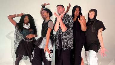 A group of five adult performers