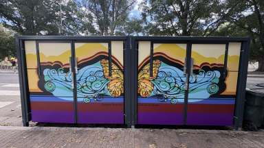Painted exterior of waste receptacle