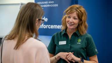 Candidate Speaking to City Employee at Job Fair