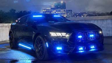 Police vehicle with lights on at night