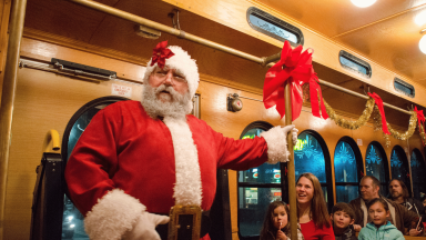 Santa on a Trolley with families