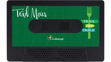 a green cassette tape illustration labeled "trail mixes, trail to table" with the visit Raleigh logo