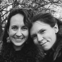 two friends look at the camera