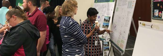 people looking at maps