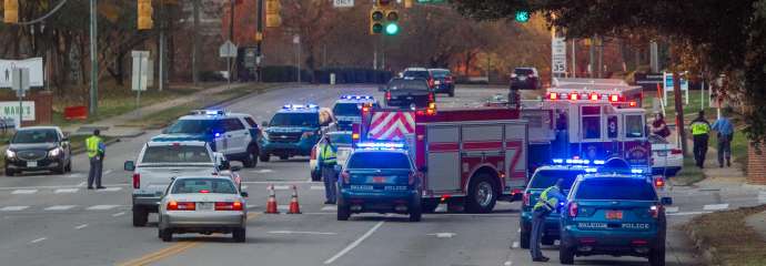 Police and fire department vehicles at an incident at Six Forks Road