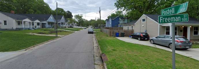 The intersection of Freeman Dr and Postell St showing the lack of sidewalk