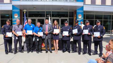 Raleigh firefighters holding certificates