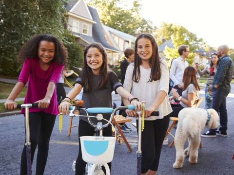 kids on bikes at neighborhood celebration