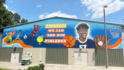 A mural at Green Road Community Center that reads Together We Can End Gun Violence
