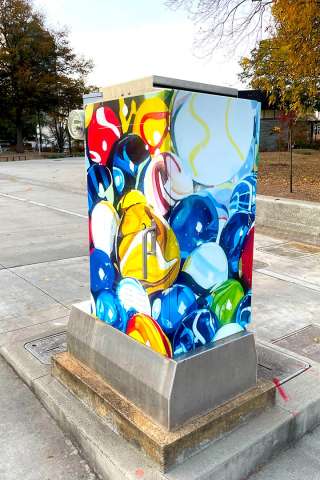 A signal box wrapped in public art by Courtney Marie Taylor