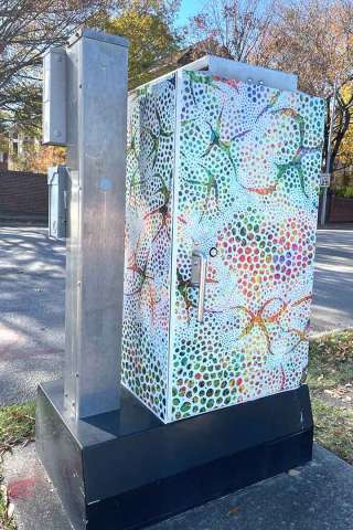 A signal box wrapped in public art by McClain Percy