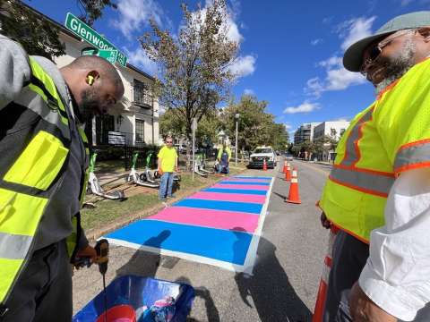 staff painting scooter corrals