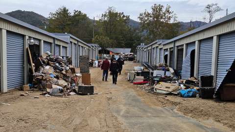 RPD officers walk through a self storage center littered with destroyed items