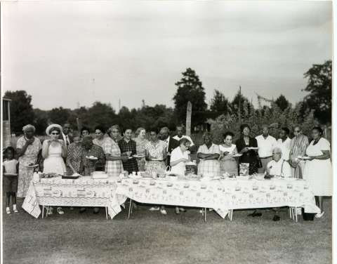 Historic photo of a picnic. Group of individuals in 1958