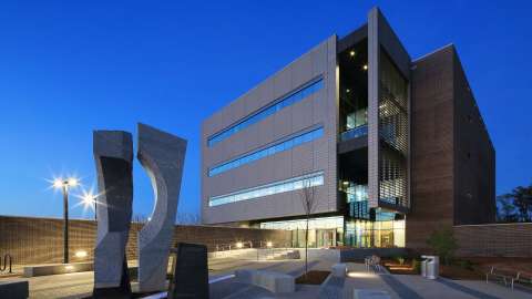Image of the Raleigh-Wake Emergency Communications building at dusk