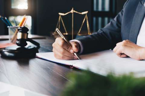 Lawyer signing papers