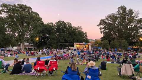 people watching jazz performance on the lawn in Moore Square