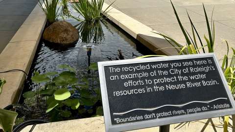 Another shot of sign next to Raleigh Water pond