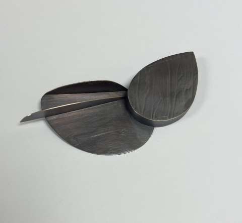 Metal hand-made Brooch that resembles leaves