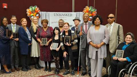 Group photo of 2024 MCPD Banquet awardees and community members standing together and smiling.