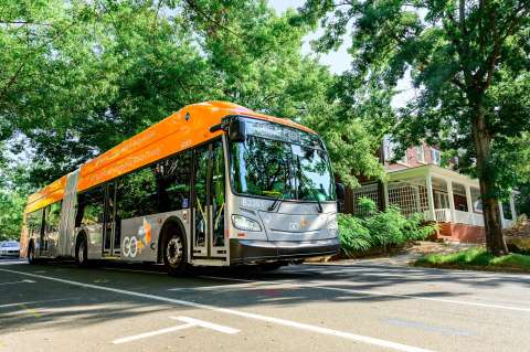 Bus Rapid Transit Orange and Grey bus rolling through downtown Raleigh
