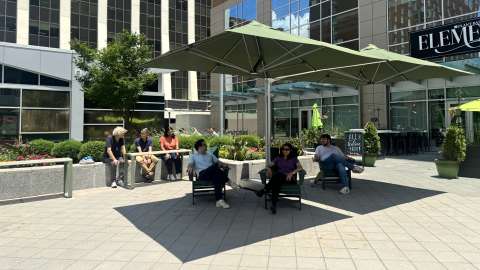 City Plaza - Tables Under Shade Umbrellas