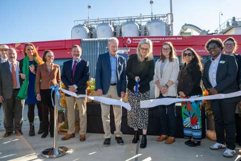 Mayor cuts ribbon with other officials at bioenergy recovery project