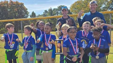 kids playing flag football as winners