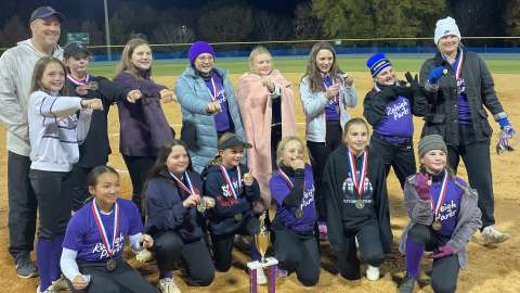 a group of girls as softball champs