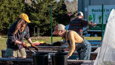 people at Marsh Creek's urban farm working in planters