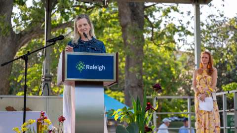 Speaker at podium on stage