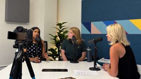 Shikha Gupta and Ellen Mathis sit in recording studio with Raleigh Magazine's Gina Stephens.