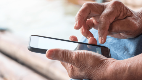 Person scrolling on their phone