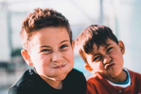 Two boys making funny faces