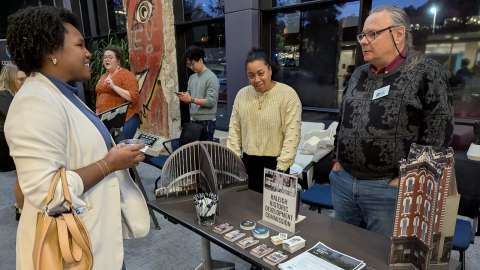 Historic Preservation Plan - People at a booth talking with someone about historic preservation