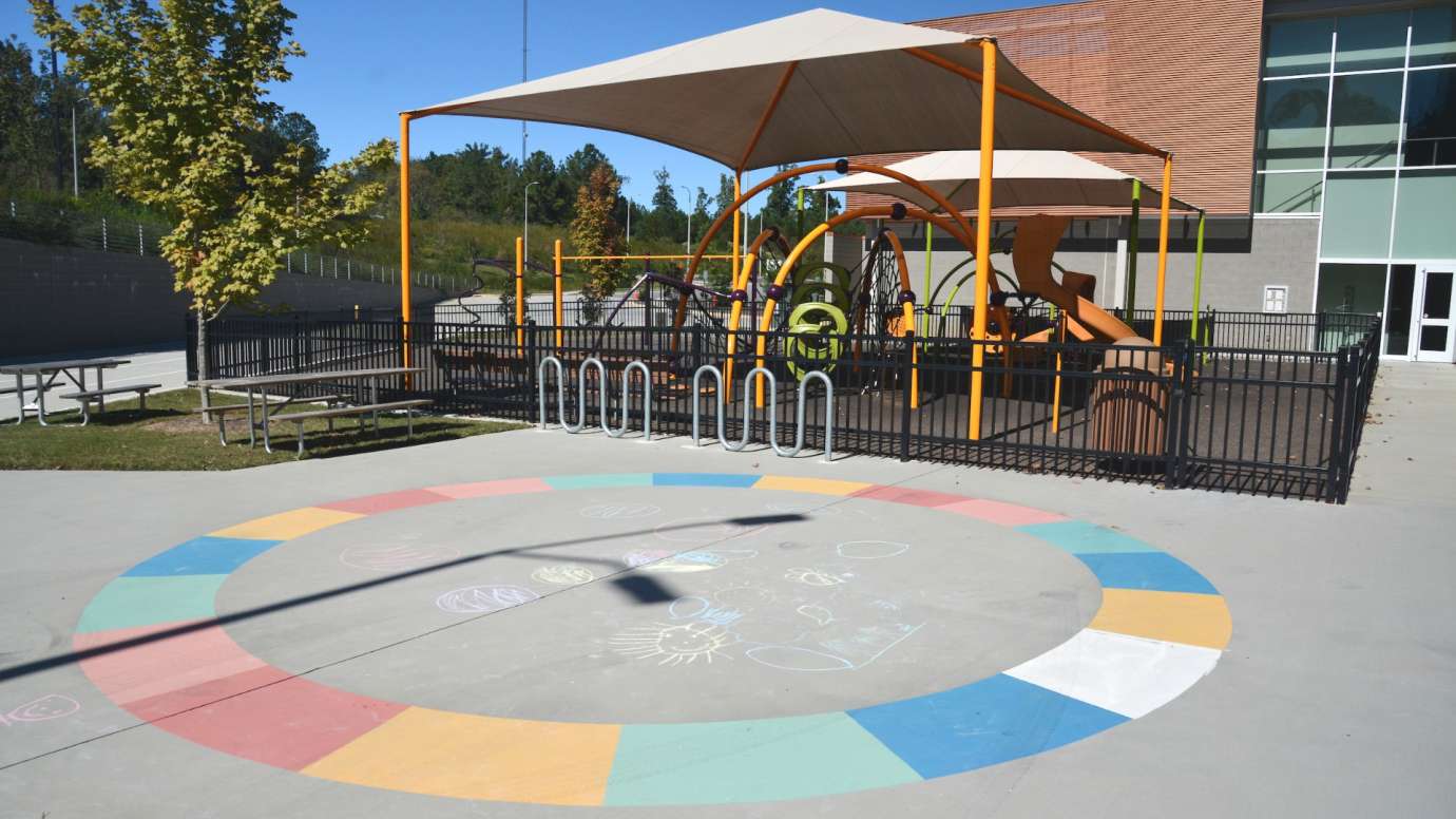Circle drawn in chalk art made up of colorful blocks at Abbotts Creek Park