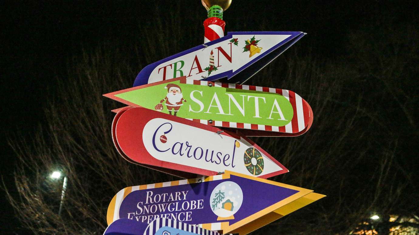 Directional sign pole for Holiday Express event