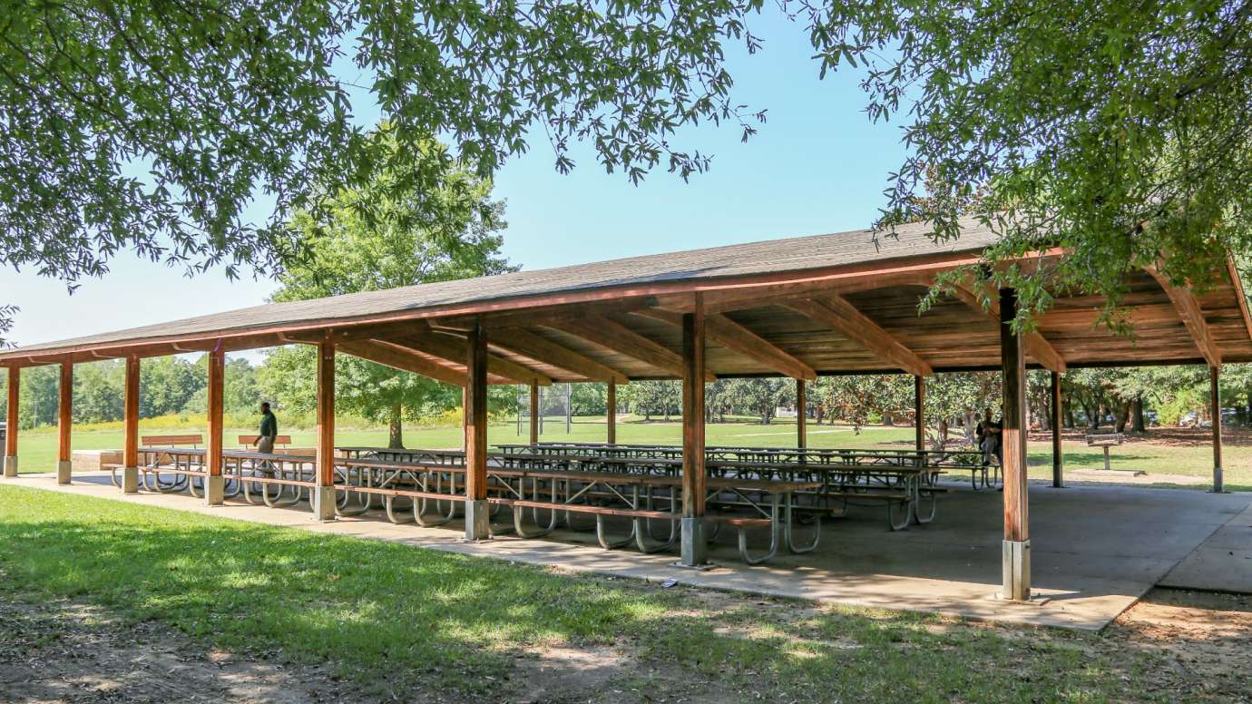 Side view of a large wooden picnic shelter at Anderson Point Park