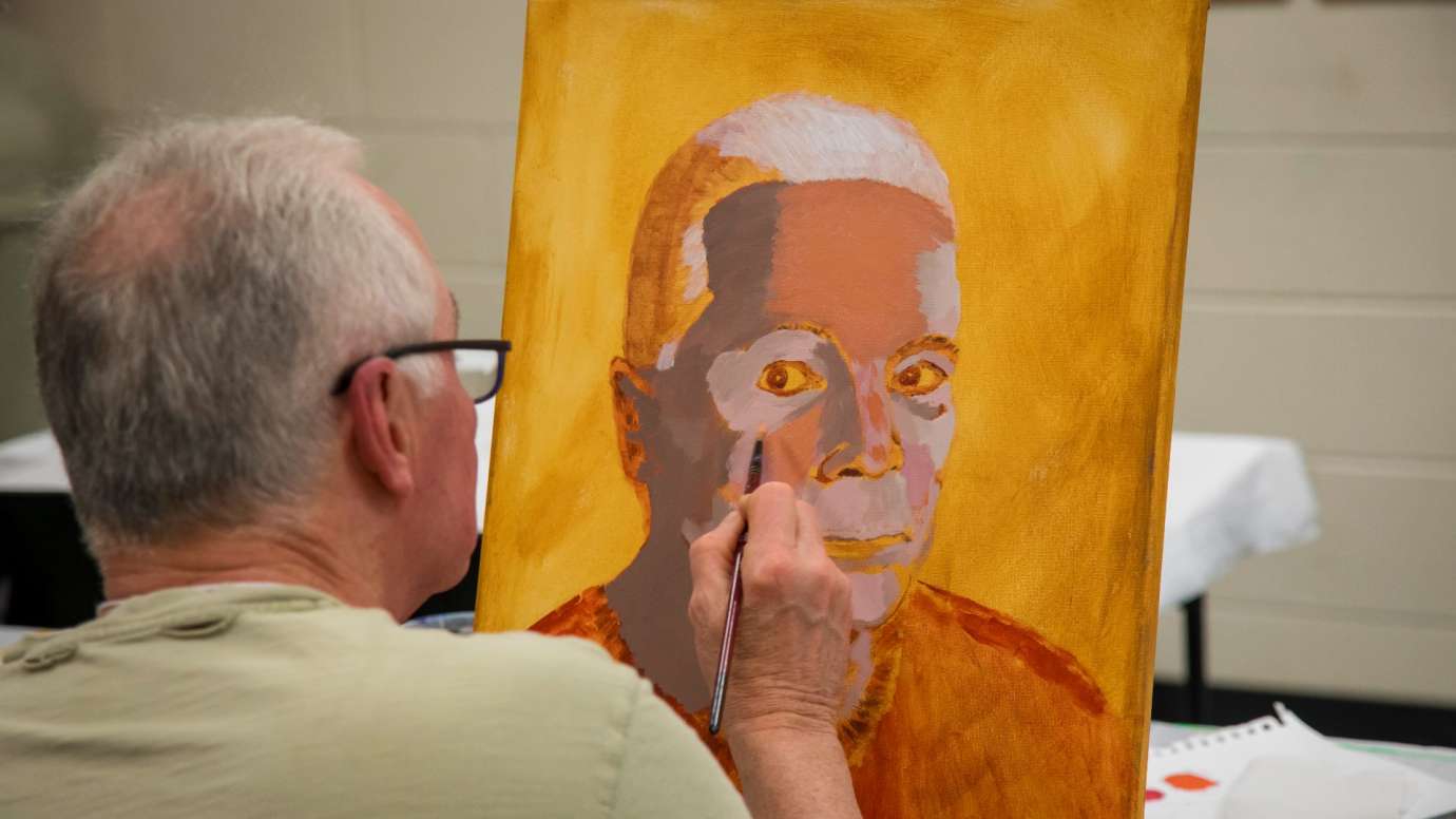 Man painting self portrait