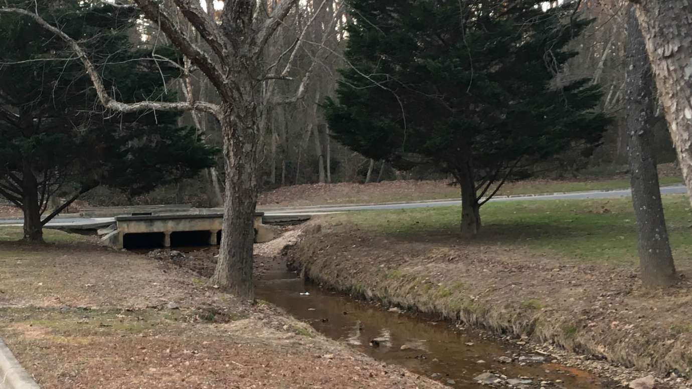A stormwater pipe on Dana Drive that runs over a creek. 