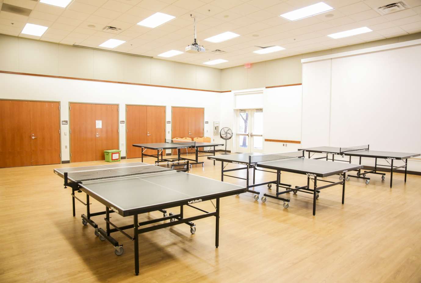 A large open room used for fitness classes, pickleball and table tennis 