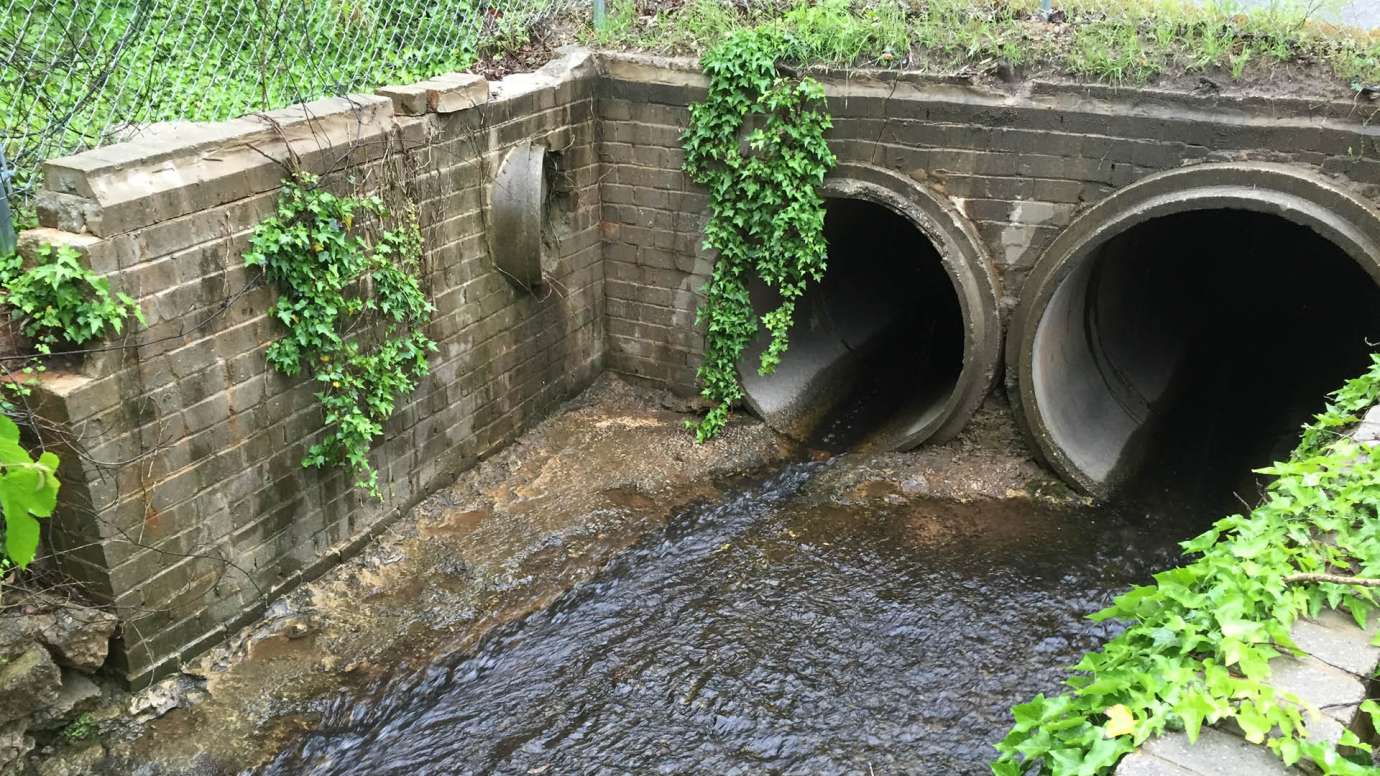 An old, circular stormwater pipe that carries water under Pineview Drive 